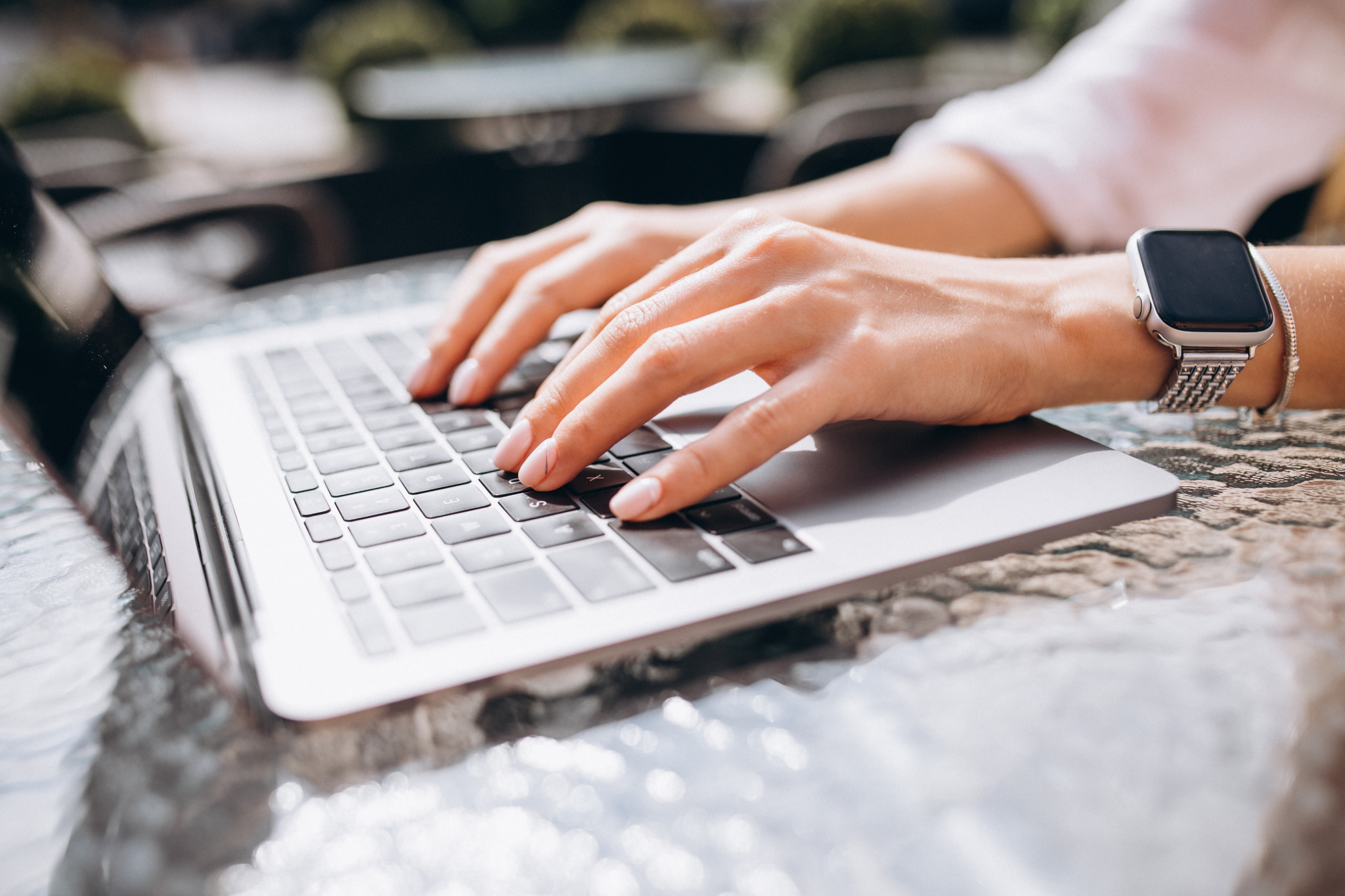 Female hands typing keyboard close up