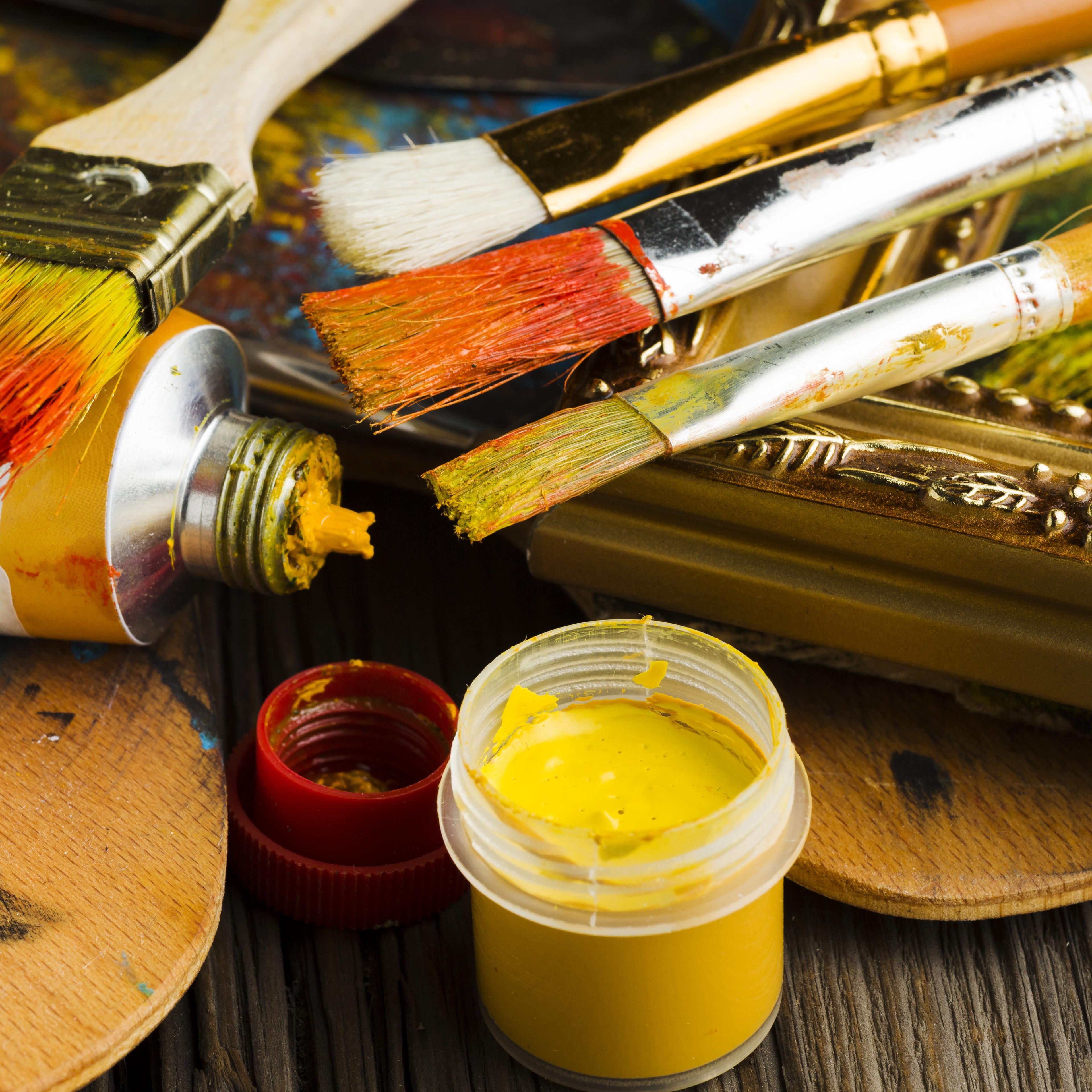 High view coloured paint brushes close up