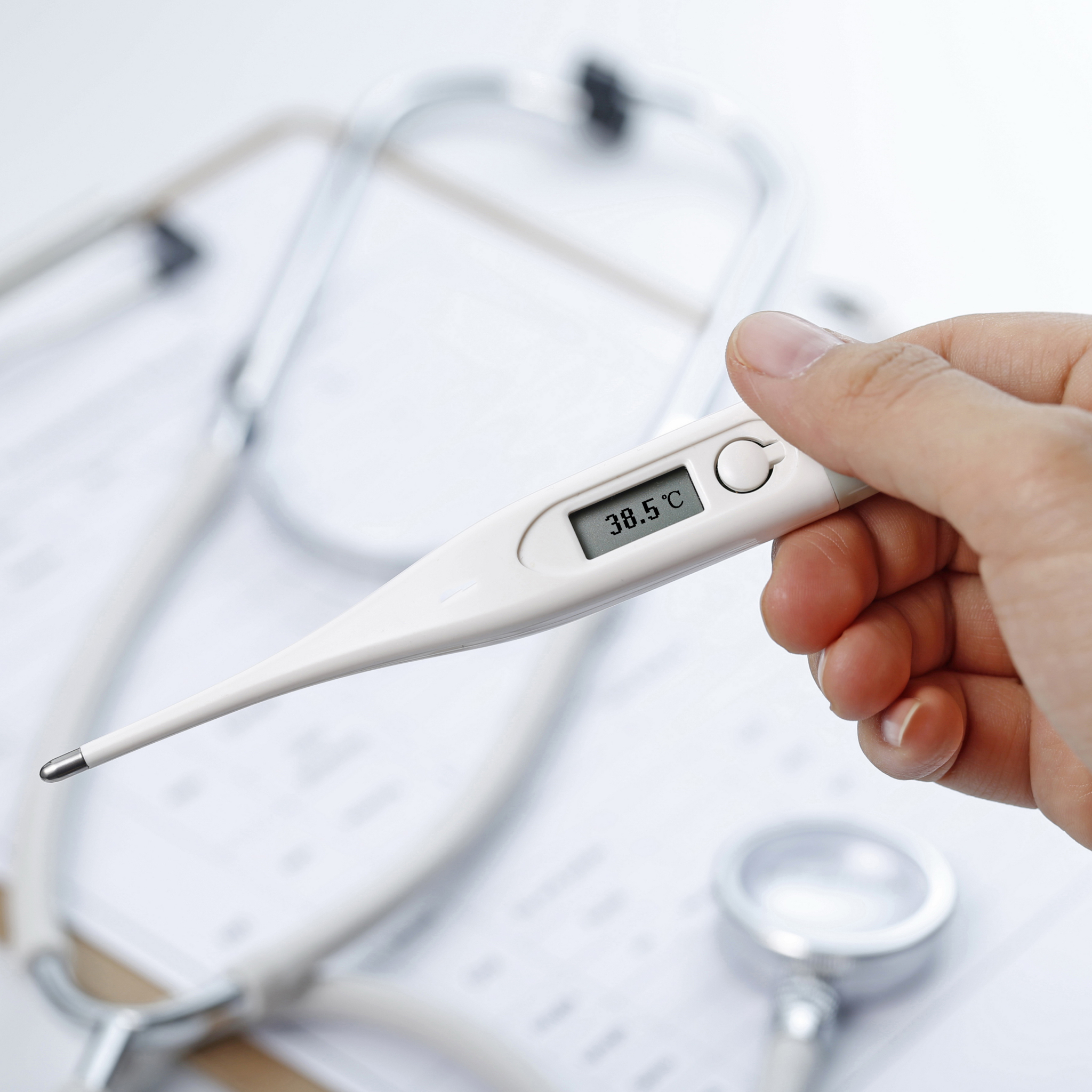 Listhand holding theromenter mesuring body temperature